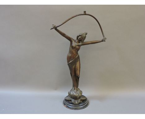 An Art Nouveau spelter lamp base, modelled as a semi naked maiden, upon a waterlily, bears signature 'Beck', 57cm high, minus