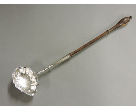 A silver toddy ladle, maker's mark PC?, London, 1743