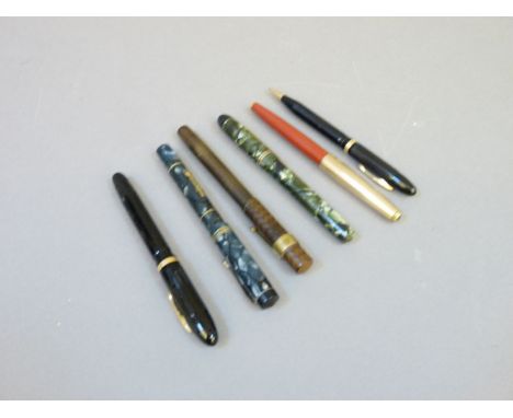 A Conklin Nozac fountain pen and pencil set, in black, with four others
