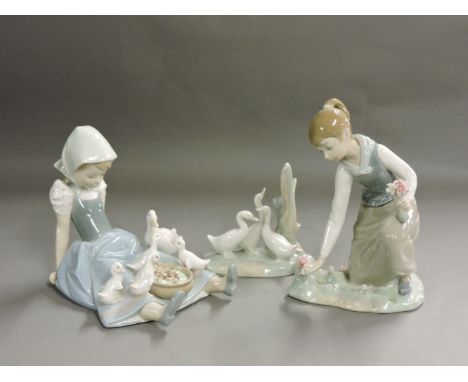 Two Lladro figure of girls, and a Nao figure of ducks