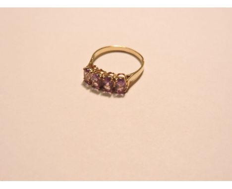 A 9ct gold four stone amethyst ring