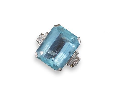 An aquamarine and diamond dress ring, the large emerald-cut aquamarine is set with baguette-shaped diamonds to each shoulder 