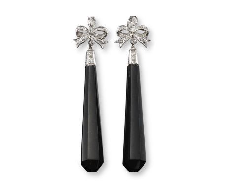 A pair of black jade and diamond drop earrings, the black jade drops suspend from a diamond-set cap and bow, in white gold, 5