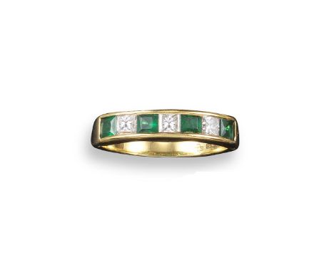 An emerald and diamond half hoop ring, the square emeralds and princess-cut diamonds are channel-set in yellow gold, size O