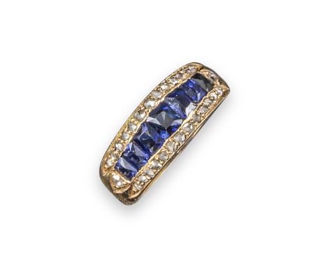 A sapphire and diamond half-hoop ring, set with a line of graduated calibre-cut sapphires within a border of diamonds in yell