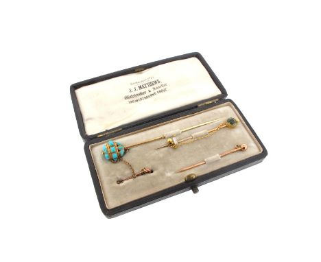 A cased set of stick pins, one decorated with turquoise cabochons, with gold safety clip, the other set with a peridot, with 