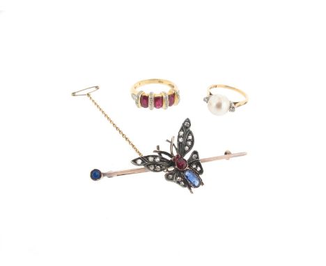 A Victorian silver and gold butterfly bar brooch, the butterfly set with diamond wings and a ruby and sapphire body, a blue s