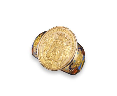 A French 19th century gold stirrup-form glove ring, the shank decorated with polychrome enamel bearing the shield for Lambert