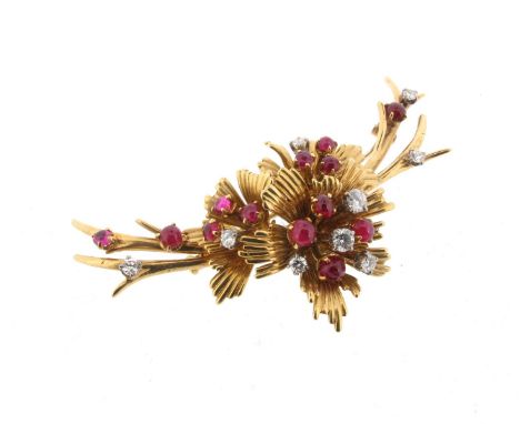 A ruby and diamond foliate brooch, set in yellow gold with cabochon rubies and circular-cut diamonds, 7cm long