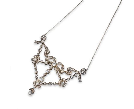 A Belle Epoque diamond necklace, the central bow and swags set with graduated cushion-shaped diamonds and suspending further 