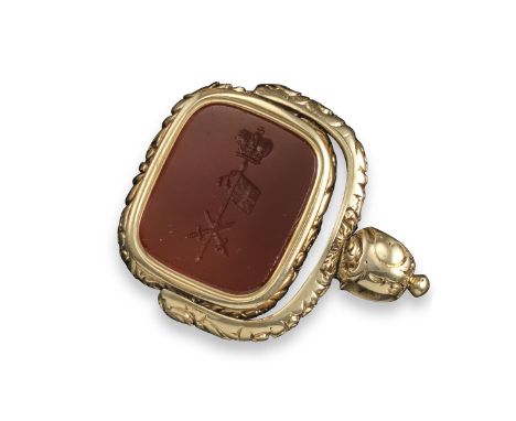 A 19th century gold spinning fob seal, chased with foliate decoration and set with a carnelian to each side, one bearing the 