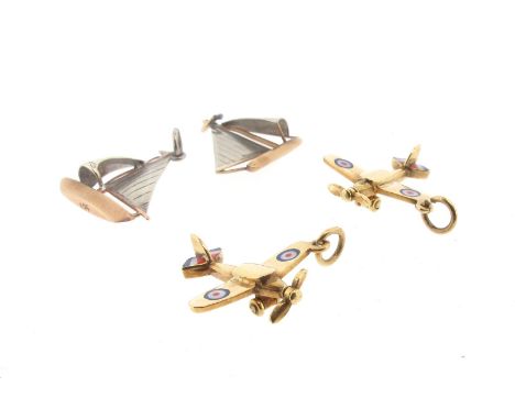 Two gold spitfire charms decorated with polychrome enamel , with two gold sail boat charms