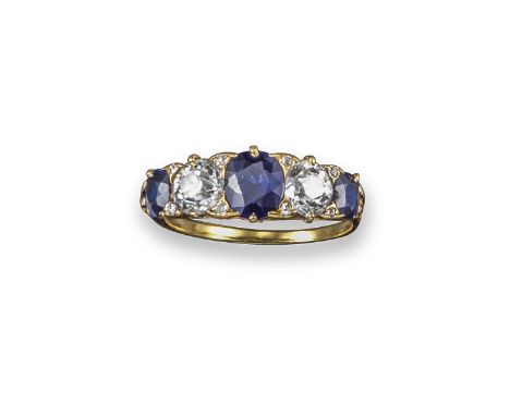 A sapphire and diamond five stone ring, alternately-set with graduated sapphires and diamonds in carved and pierced yellow go