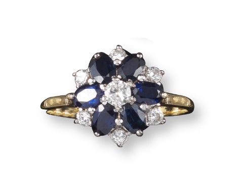 A sapphire and diamond cluster ring, the stylised flowerhead set with oval-shaped sapphires and circular-cut diamonds in plat