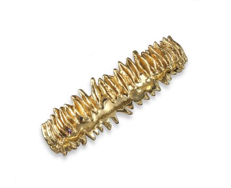 An abstract gold bangle by Margaret Turner, set in 18ct yellow gold, maker's mark and London marks for 2003, 83g
