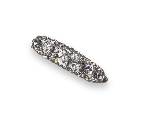 A diamond five-stone ring, the graduated old circular-cut diamonds are set in a carved and pierced yellow gold mount, with di