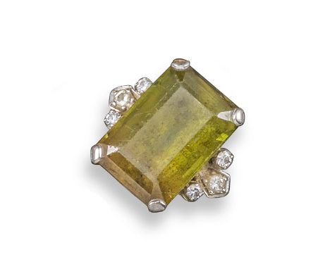 A tourmaline and diamond ring, the emerald-cut tourmaline is set within diamond cluster shoulders, size O 1/2