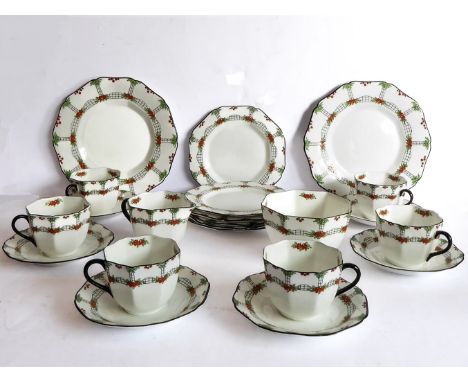 A six-place Sutherland China tea-service comprising cups and saucers (one cup cracked), 17 cm side plates,&nbsp;sugar bowl, m