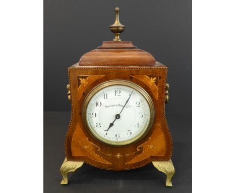 An early 20th century mahogany, chequer-strung and marquetry bracket-clock: the shaped gilt-metal neoclassical finial above a