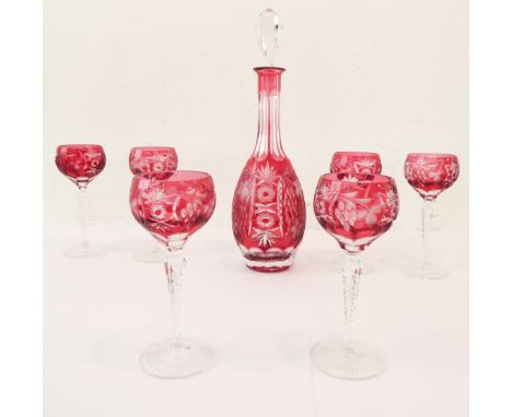 A mid-20th century Bohemian red flash-cut, club-shaped decanter with spire stopper, together with six matching hock glasses, 