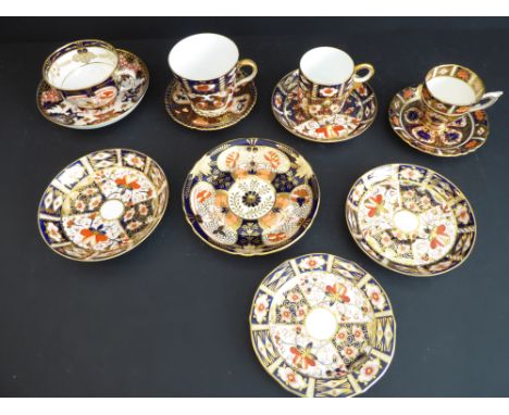 A good selection of Royal Crown Derby ceramics hand-gilded and decorated in the Imari palette to include various cups and sau