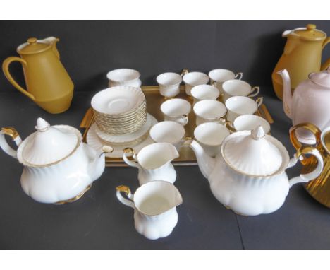 A Royal Albert 'Val D'or' tea service comprising:2 teapots;2 milk jugs and 2 sugars;11 cups and saucers;3 side plates and one