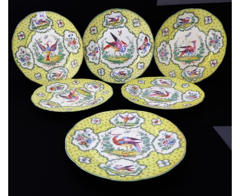 Six porcelain cabinet plates in the Chelsea style (probably continental): white ground with yellow border and vignettes of 'C