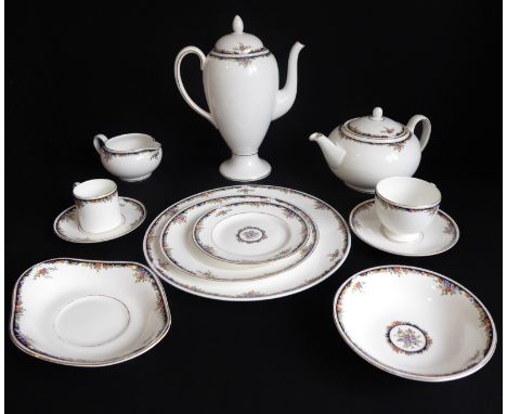 A 68-piece Wedgwood 'Osborne' tea and coffee service comprising:10 teacups and saucers;17 coffee cans and 18 saucers;2 tea an