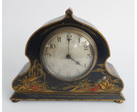 An early 20th century mantle-clock: lacquered and decorated in Chinoiserie style, the silvered dial with Arabic numerals surm