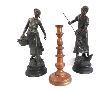 A pair of late 19th century French spelter figure models of peasants at work, raised on turned ebonised plinth socle bases (5