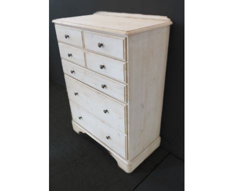 A good modern limed-pine bedroom chest: four half-width over three full-width graduated drawers, raised on shaped bracket fee