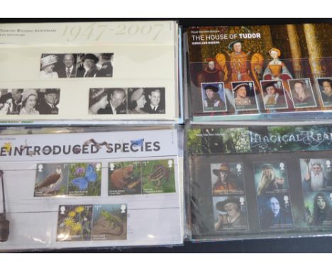 Eighty-one sets of mounted commemorative and definitive mint GB stamps to include approx. 140 First Class stamps. (Total appr