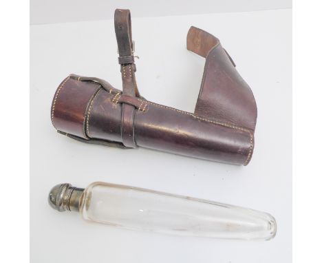 A vintage leather-cased glass hunting flask with silver-plated domed top