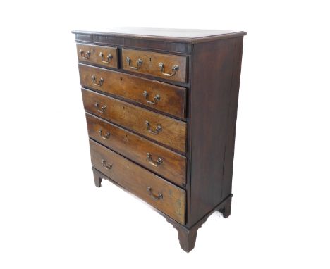 A good late 18th century oak chest of interesting configuration: two half-width over four full-width graduated drawers, raise