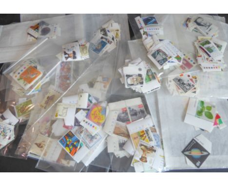 Approx. 850 mint GB stamps to include 73 First Class. Mostly commemoratives, all sorted by denomination and with a total face