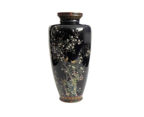 A Japanese cloisonné vase circa 1900; decorated with prunus trees, chrysanthemums and bamboo against a black background with 