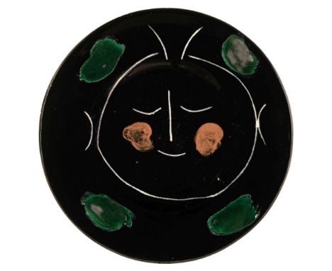 Picasso (Pablo, 1881-1973). Service visage noir, 1948, a white earthenware ceramic plate, partially engraved, with colored en
