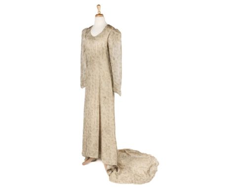 Clothing. A 1930s wedding or court dress, full length fitted cream lamé gown with train, handmade, patterned with leaves and 