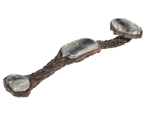 Ruyi Sceptre. A Chinese 19th century style ruyi sceptre, carved the soft wood carved with peaches, inset with three large bla