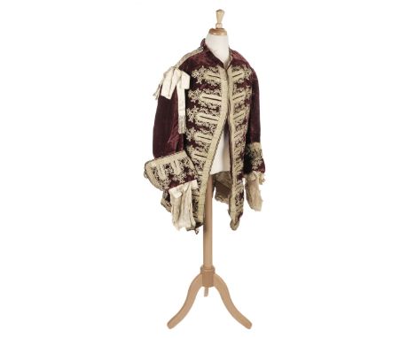 Clothing. A gentleman's coat for theatre or fancy dress, late 19th century, handmade burgundy velvet coat, with standing coll