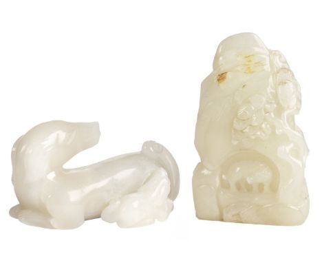 Jade. A Chinese 18/19th century style jade boulder, carved as an elder and ox before a cave entrance with pine tree, the oppo