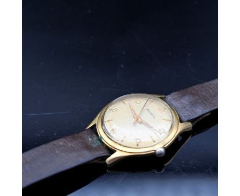 A vintage Helvetia gentleman's wristwatch. The golden dial with raised gilt batons denoting hours, Arabic markers at the half