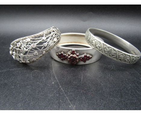European silver (835@ bangle with rosebud cut bohemian garnets, a silver 925 bangle with paste stones and&nbsp; a white metal