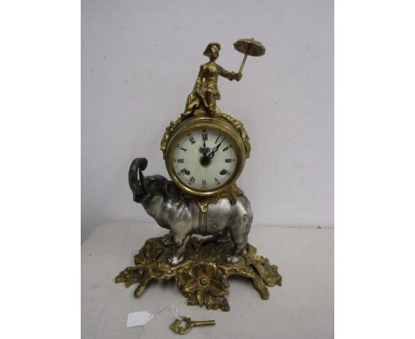 Brevattato brass and pewter mantle clock in the form of an elephant supporting a dial and movement surmounted by a cast figur