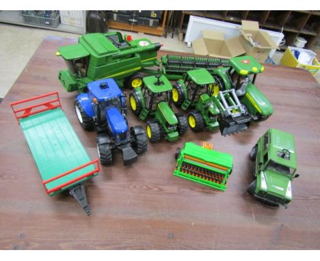 Collection of Bruder farming toys to include John Deere combine harvester and tractors, Land Rover and New Holland tractor et