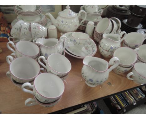 A Johnson Bros dinner and tea service in white with floral design (80  pieces approx)