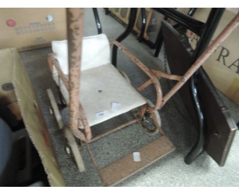 A vintage toy pushchair