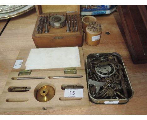 A selection of clock and watch repair tools and keys