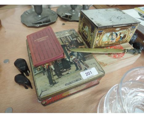 A miscellaneous selection including vintage tins, brass letter opener, carved elephants etc