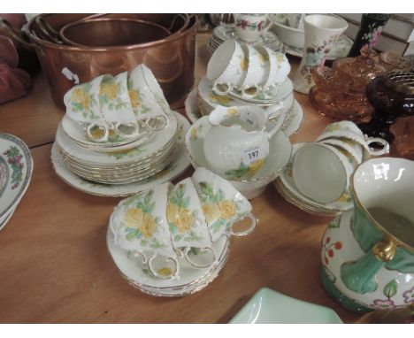 A Pointons No:2223 part tea service decorated in white and gilt with yellow rose design (38 pieces approx)